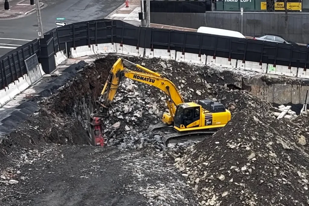 Blasting and excavation preparation at Skye Halifax by United Gulf Developments in Halifax, Nova Scotia, including drilling and tie-back anchor installation