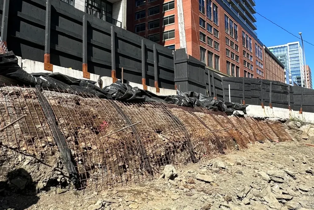 Rock anchor installation along the excavation wall at the Skye Halifax construction site.